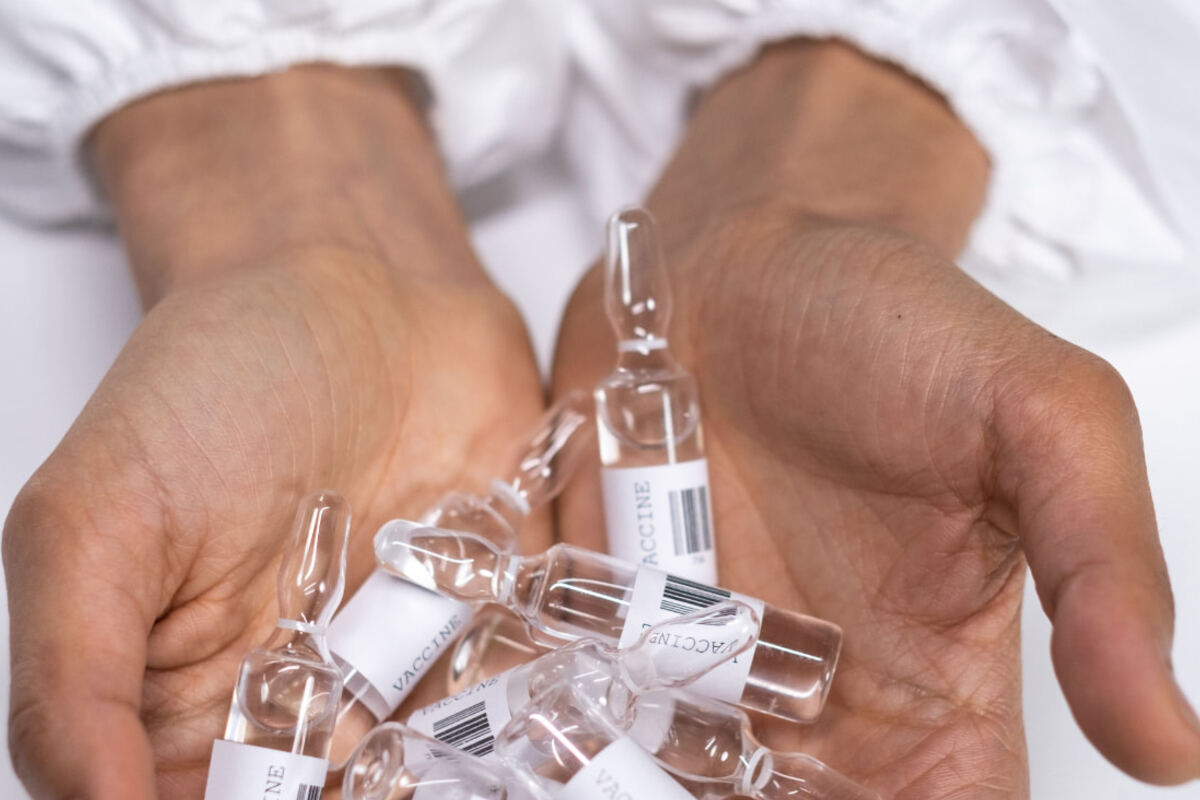 Sealed pharmaceutical ampoules held for inspection before packing