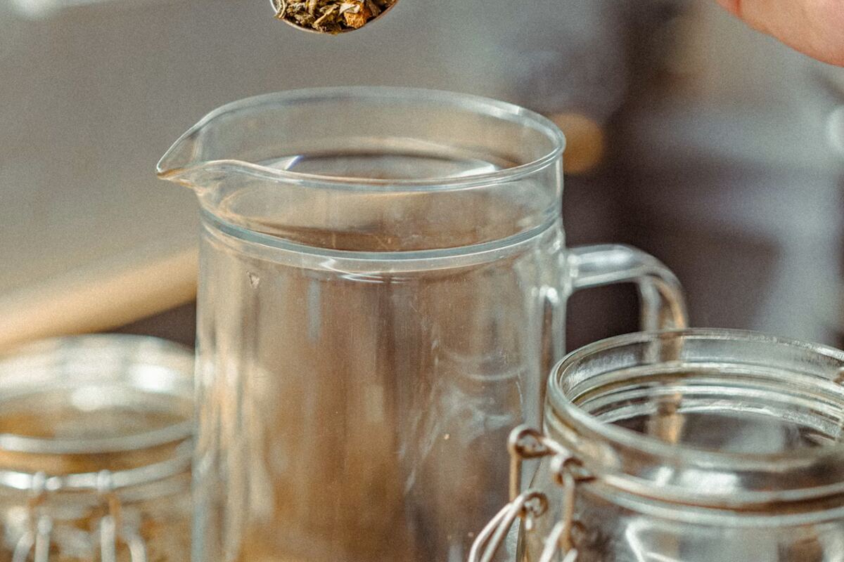 Dried botanical raw materials being measured in a preparation area
